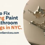 A close-up of a hand using a putty knife to scrape peeling white paint off a bathroom ceiling before a repair.
