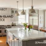 High-end renovated open-concept Staten Island kitchen featuring a large marble island, farmhouse sink, and custom gray cabinetry.